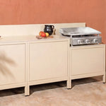 Cocina exterior Pilotis blanco crema con plancha Vivaplancha integrada.
::visuel:creme