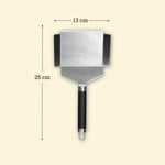 Espátula para verduras de acero inoxidable de 25 cm con hoja ancha de 13 cm y bordes elevados, mango negro y anilla para colgar.