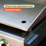 Primer plano de una plancha Vivaplancha que muestra la placa de acero inoxidable alimentario lisa de 6 mm de grosor, con evacuación integrada en la parte delantera.